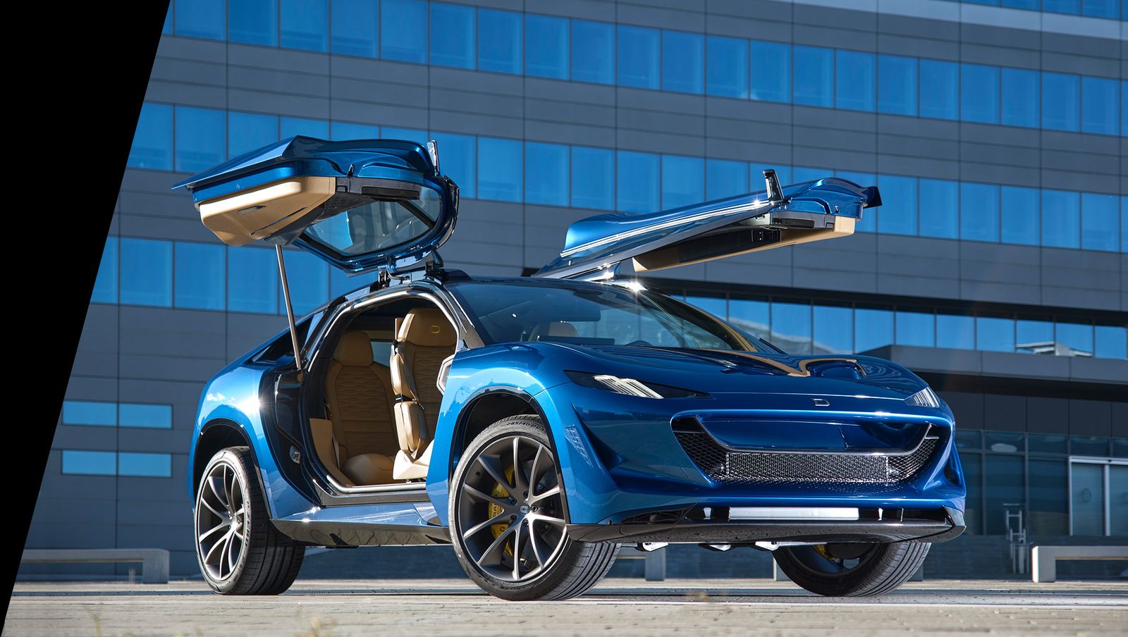An image of the gullwing Drako Dragon electric car, with doors open.