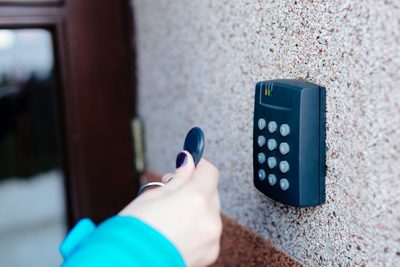 Woman opening house doors Choose From Best-in-Class Access Control Hardware