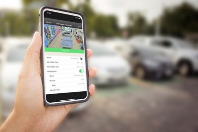 Smart phone with white screen in hand on blurred Parking backgro Respond to and Resolve Incidents with Analytics